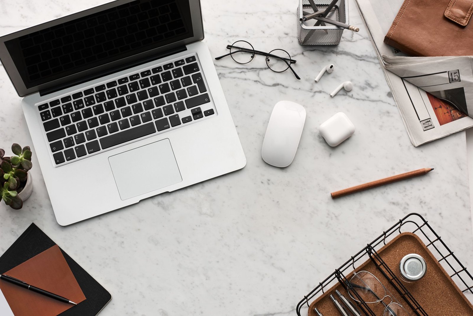 A calm desk with a laptop and work tools ready for reference