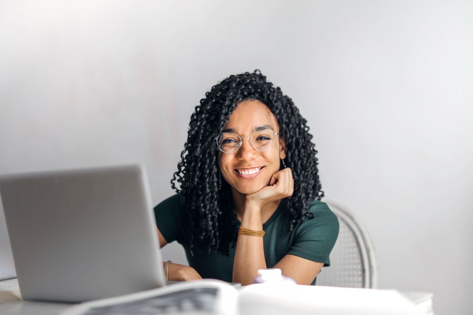 A business operator responding from her laptop